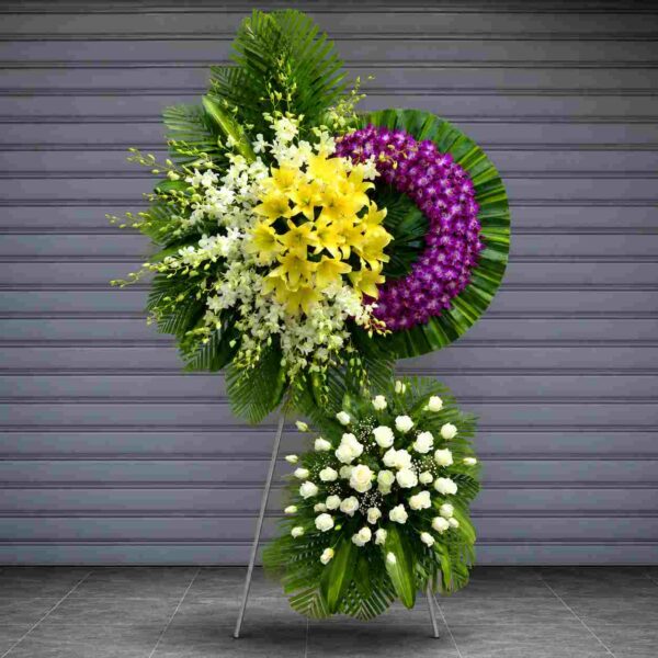 Kệ chia buồn tiễn biệt 409 với hoa lan tím, hoa ly vàng và hoa hồng trắng, thiết kế sang trọng thể hiện lòng tiếc thương và sự kính trọng sâu sắc.